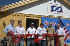 veterans at uso event cutting some kind of ribbon