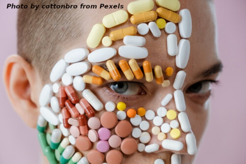 terson with pills covering right side of face