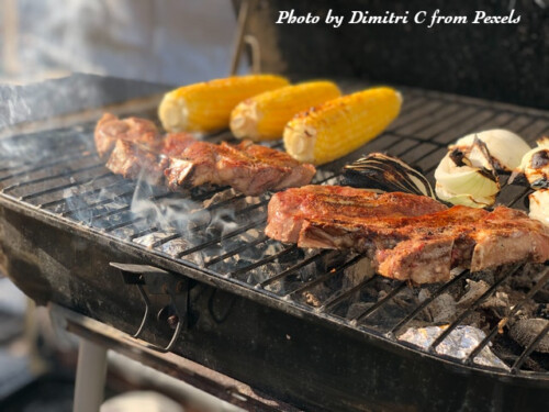 corn and steak grilling on bbq