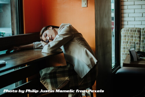 woman sleeping on desk