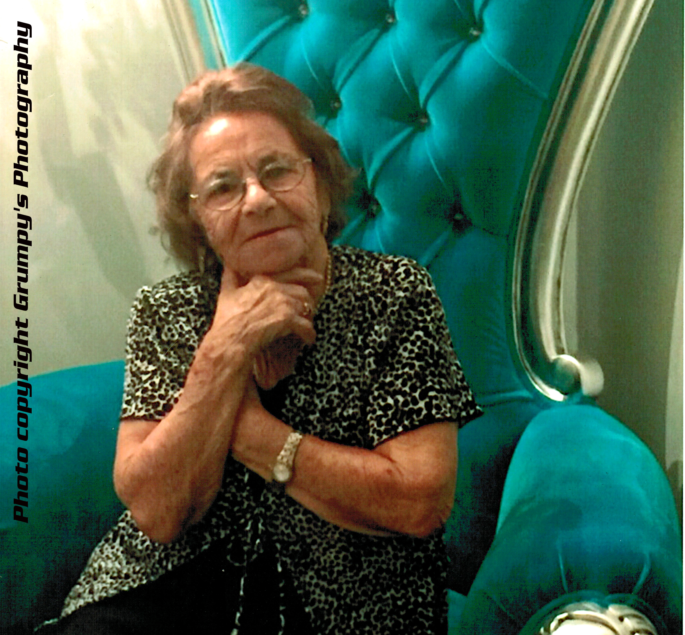 senior lady sitting on blue chair