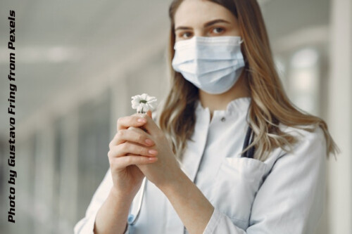 nurse holding a flower