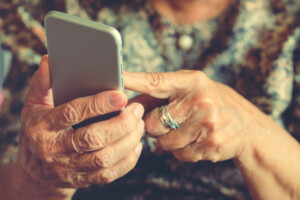 senior lady holding cel phone