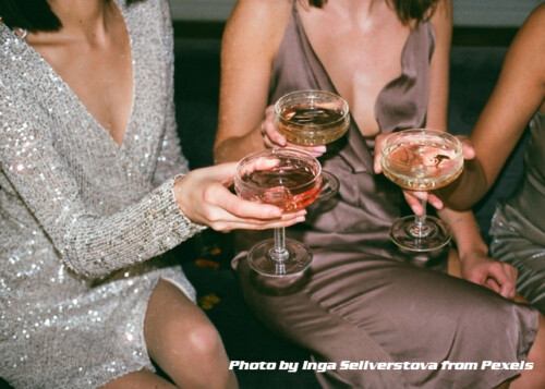 three women toasting with champagne glasses