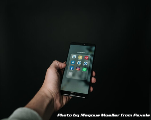 man holding cel phone