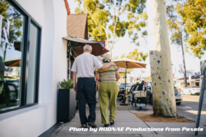 senior couple walking on sidewalk