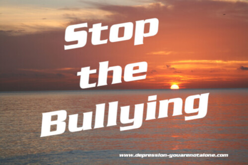 the words stop the bullying over ocean sunrise (copyrighted)