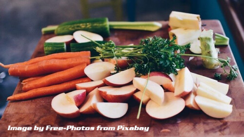 fruits, vegetables and herbs on cutting board