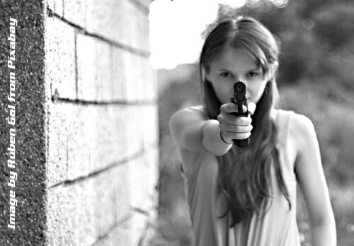 girl poining a gun