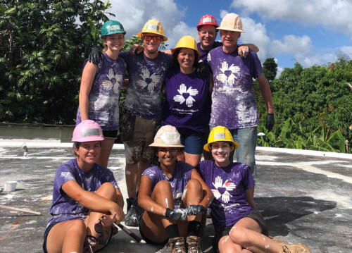 volunteers in hard hats