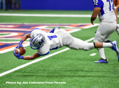 football player diving for touchdown