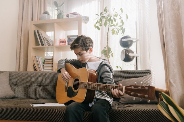 boy playing guitar