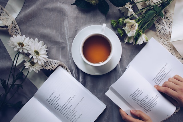 two books and coffee cup