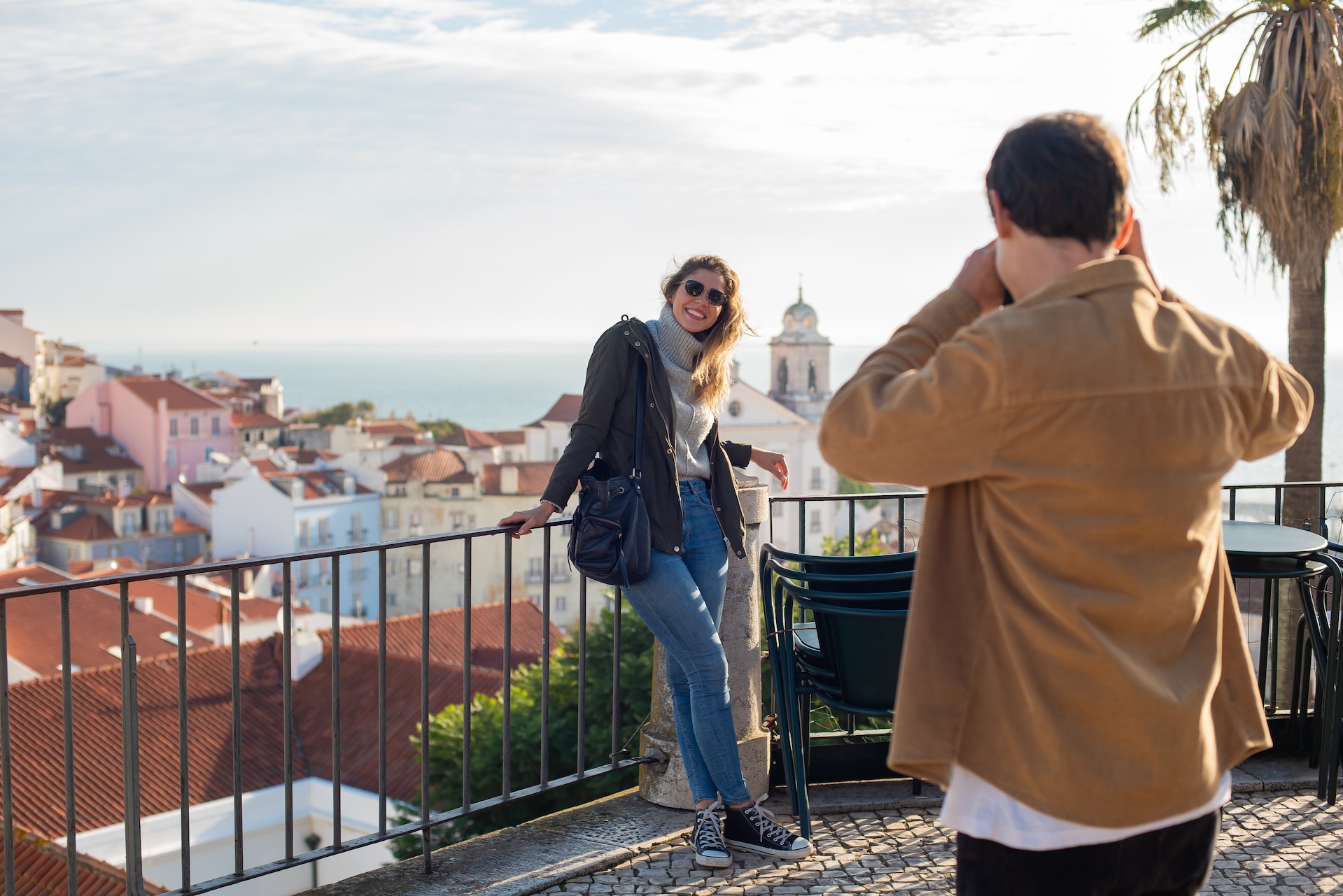 man taking picture of a woman